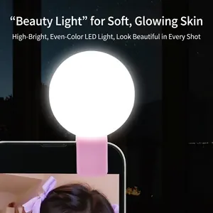 Pink clip-on LED selfie ring light for smartphones featuring soft skin-toning beauty glow