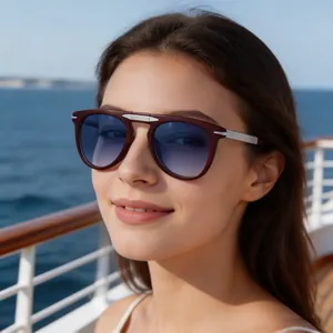 Close-up of vintage sunglasses with silver arrow detail on a model at sea