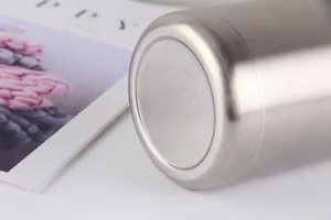 Detailed close-up showing brushed stainless steel texture and base of the 12oz beer tumbler