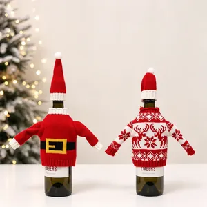 Detail of knitted Christmas wine bottle covers featuring Santa belt and reindeer patterns