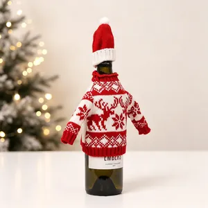 Detail of Christmas wine bottle cover with knitted reindeer sweater and mini santa hat