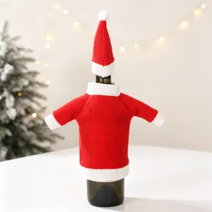 Detail of Christmas wine bottle cover with soft knitted fabric and mini holiday hat decoration