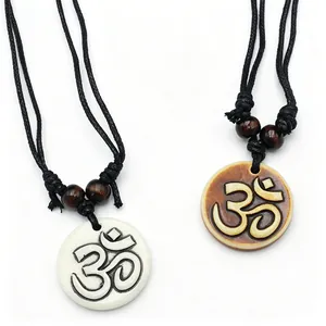 Sacred Om resin pendants with bone-like finish on black cord for yoga meditation