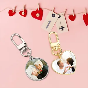 Detailed view of custom sublimated heart and round keychains with personalized photos