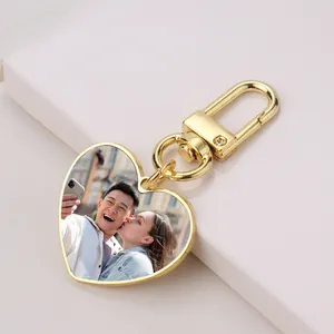 Close-up of golden heart-shaped sublimation keychain with personalized photo insert