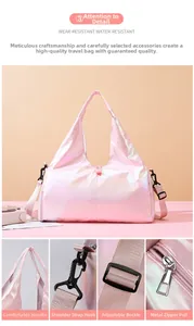 Detail view of pink holographic travel bag featuring reinforced handles and metal hooks