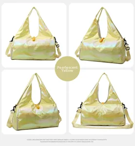 Detail of pearlescent yellow fitness bag with shoulder strap and side zipper pocket