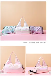 Detail view of holographic gym bag showing a separate zippered shoe compartment