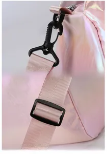 Detail of the durable rotating swivel hook and adjustable buckle on a pink laser travel bag