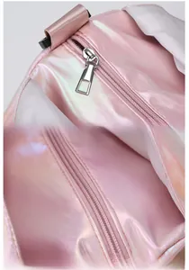 Detailed close-up of metal zipper and stitching on pink holographic yoga fitness bag
