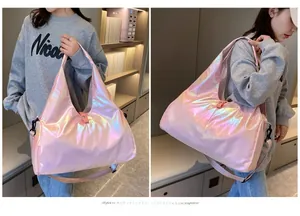 Close-up of pink holographic gym bag with iridescent finish and metallic gloss surface