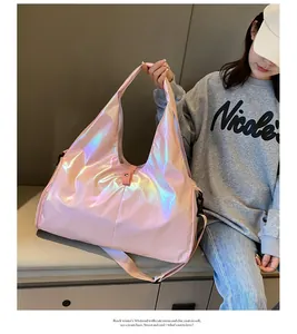 Action shot of holographic pink travel bag showing laser finish and large capacity