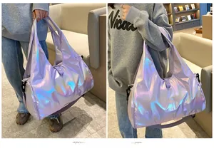 Detail of laser iridescent travel bag with metallic finish and adjustable shoulder strap