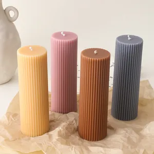 Modern ribbed cylindrical soy wax candles in four pastel colors for home decor