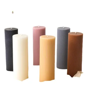 Modern pillar soy candles with vertical ribbed textures in six assorted neutral tones