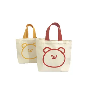 Cute cartoon bear canvas lunch bag set in vibrant red and yellow minimalist hand-held design