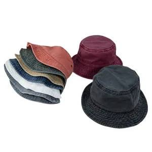 Close-up of vintage washed cotton bucket hat showing metal eyelets and breathable fabric texture
