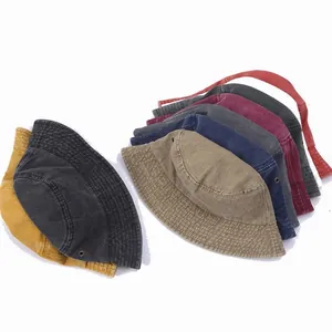 Detail of vintage denim bucket hats showing multiple colors and metal air vent eyelets