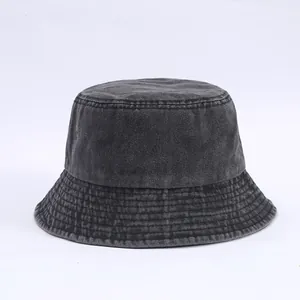 Detailed view of deep grey washed denim bucket hat with reinforced parallel brim stitching