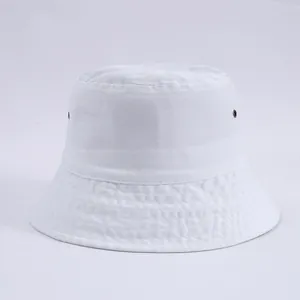 Detailed texture of a white cotton bucket hat with bronze ventilation eyelets