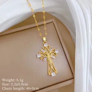 Detailed view of micro-pave gold cross pendant with dimension and weight specifications