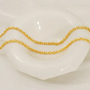 Minimalist 18K gold-plated stainless steel O-chain necklace on a white ceramic plate
