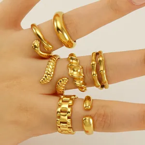 Collection of adjustable gold stainless steel rings with unique irregular geometric designs