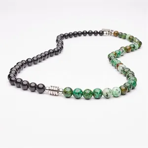 Close-up of 6mm obsidian and green stone beaded necklace with stainless steel OT clasp