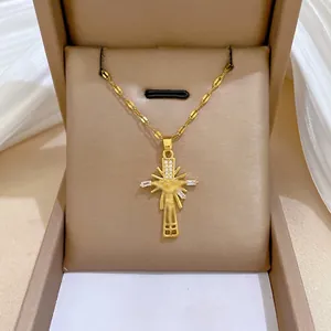 Titanium gold cross necklace with Jesus relief and zircon inlay in a brown jewelry box