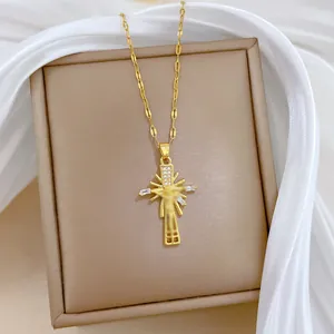 Close-up of gold-plated titanium steel cross necklace with micro-pave zirconia details