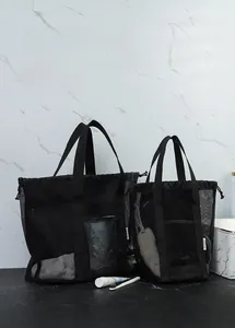 Detail of black mesh beach bag set showing durable nylon mesh and waterproof PVC base