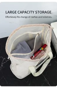 Macro detail of spacious mesh beach bag interior with translucent zipper pocket and handle