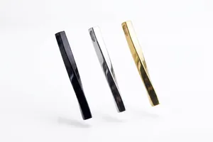 Detailed view of twisted titanium steel bar pendants in black, gold, and silver finishes