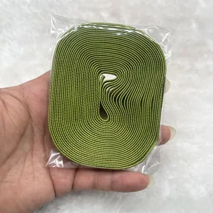 Macro shot of olive green elastic velvet ribbon roll with a fine woven texture detail