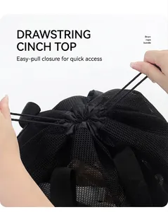 Action shot of mesh beach bag showing the draw rope bundle closure and handle detail