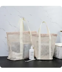 Detail of mesh storage tote bag with drawstring closure and marble background