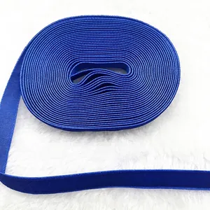 Close-up of 1cm royal blue velvet ribbon with a detailed woven texture on white plush