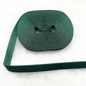 Close-up of 1cm dark green velvet ribbon with soft texture for DIY gift wrapping