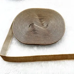 Macro detail of 1cm brown velvet ribbon with soft flocking and woven texture for DIY crafts