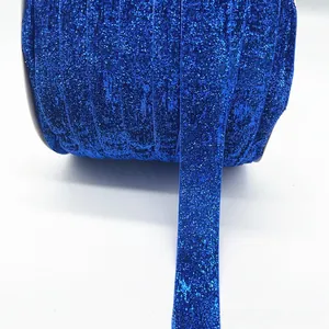 Macro view of blue glitter elastic ribbon 1cm wide for DIY gift wrapping and decoration