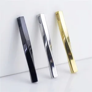 Polished minimalist twisted long bar pendants in black, silver, and gold stainless steel
