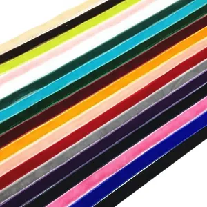 Colorful 1cm velvet ribbons for gift wrapping and DIY crafts arranged on white background