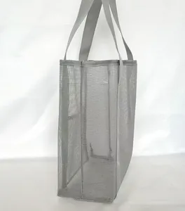 Detail view of the gray mesh beach bag showing double handles and breathable texture