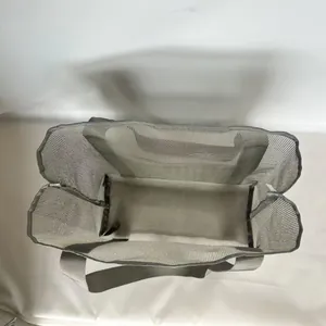 Top-down view of a grey mesh beach bag showing spacious interior and reinforced base