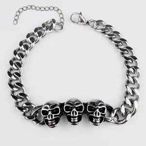 Silver punk skull curb chain bracelet with adjustable clasp on white background