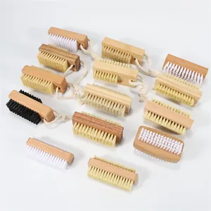 Various wooden nail brushes with sisal and pig bristles on a clean white background