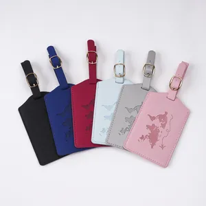 Detailed view of six colorful PU leather luggage tags with embossed world map patterns