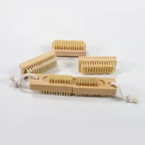 Detail of eco-friendly bamboo nail brushes with natural bristles and cotton hanging ropes