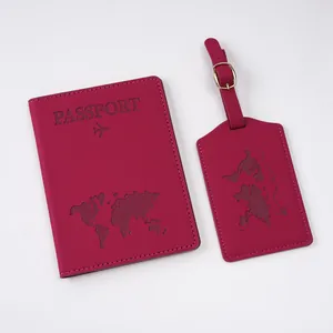 Close-up of burgundy world map embossed passport holder and matching luggage tag set