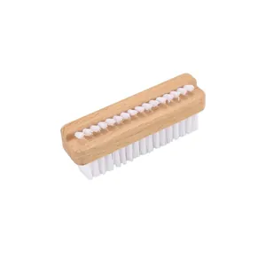 Detail of double-sided wooden nail brush with white bristles for deep cleaning finger gaps